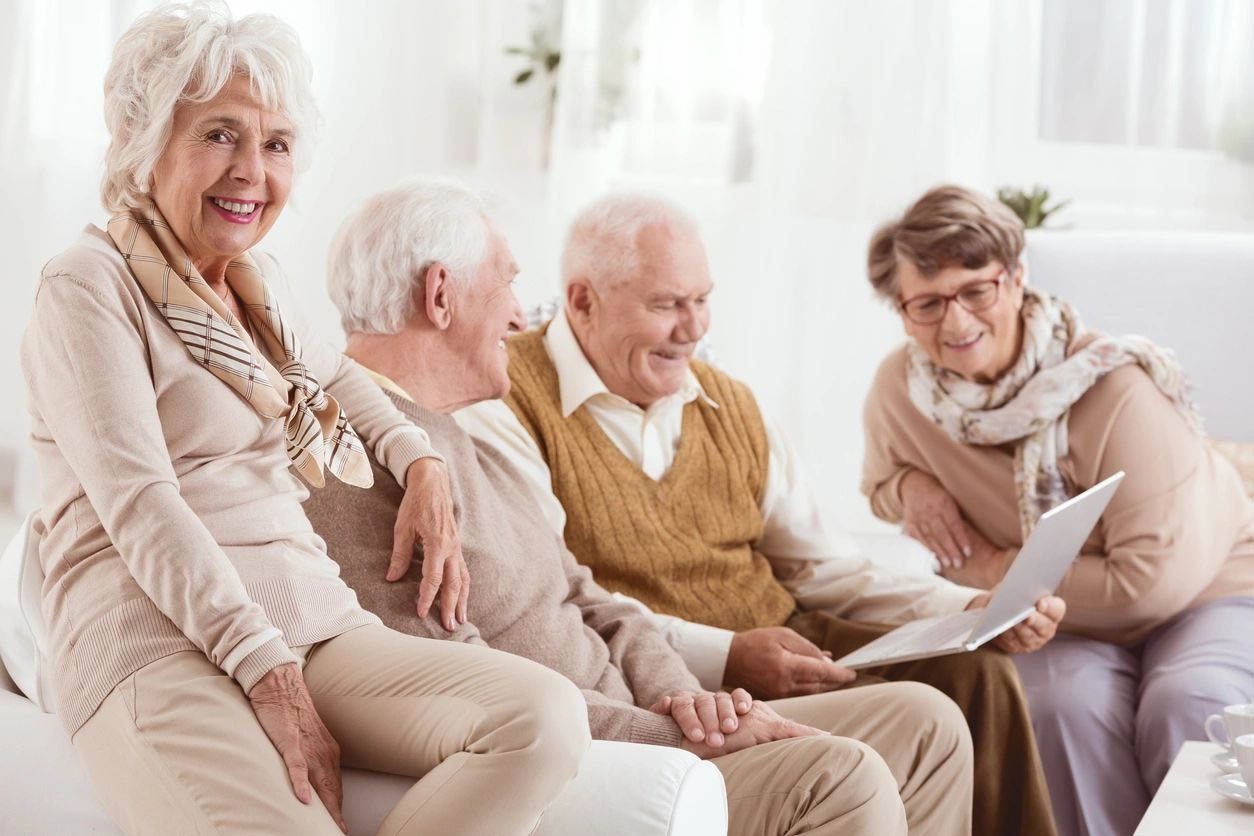Elderly friends enjoying time together indoors.