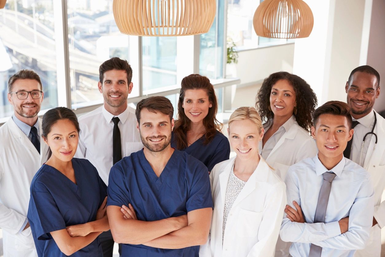 Group of medical professionals smiling together.