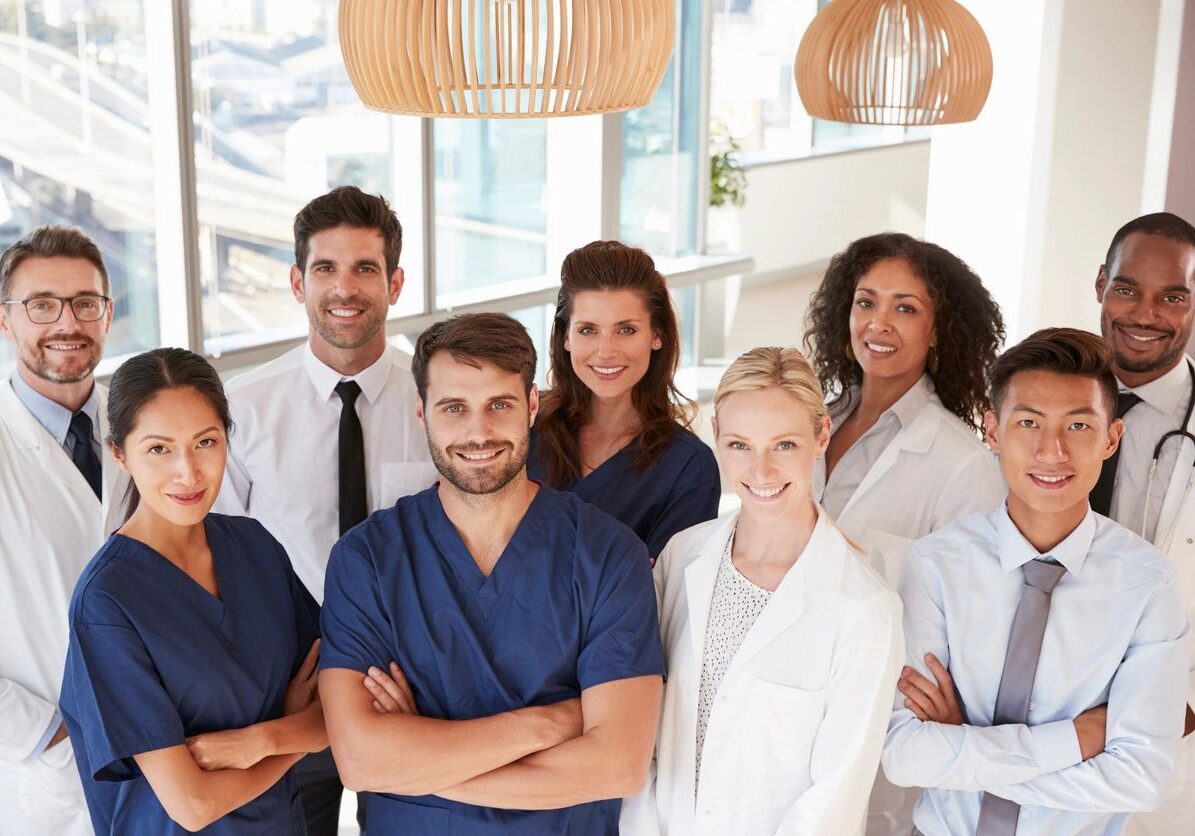 Group of medical professionals smiling together.